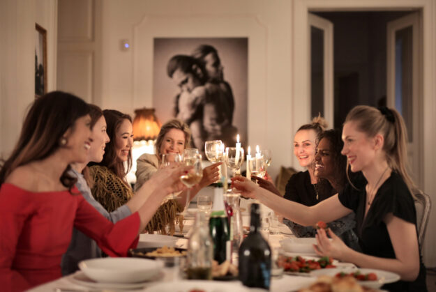 Canva – Group of People Sitting on Dining Table