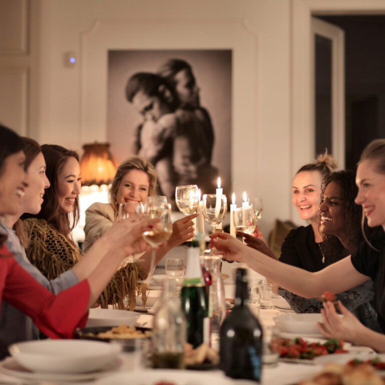 Canva – Group of People Sitting on Dining Table