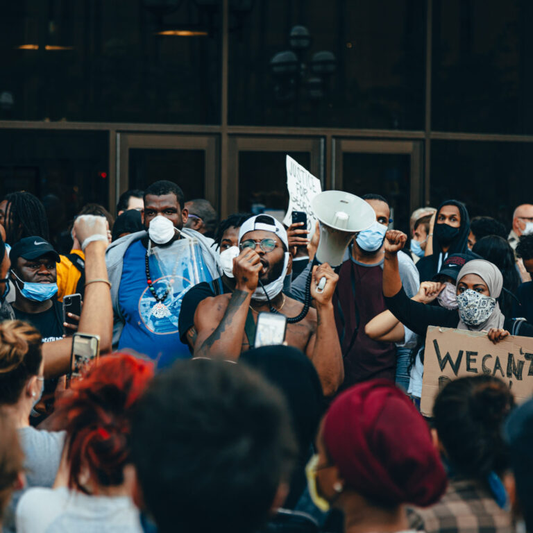Canva – Crowd of Protesters Holding Signs